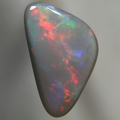 SOLID SEMI BLACK OPAL Large rolling flashes of red with violet